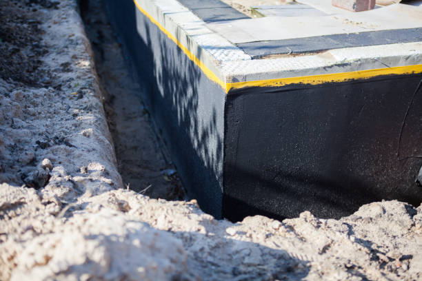 Professional Waterproofing technician working in Bryantown, MD